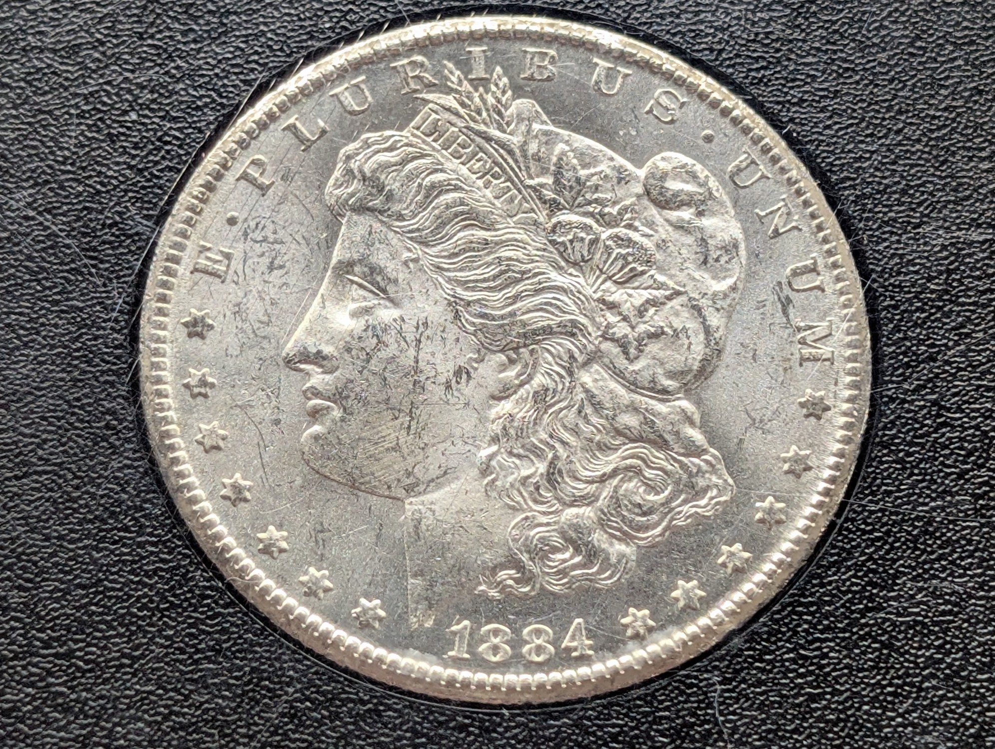 1884-CC Morgan 90% Silver Dollar - Slabbed