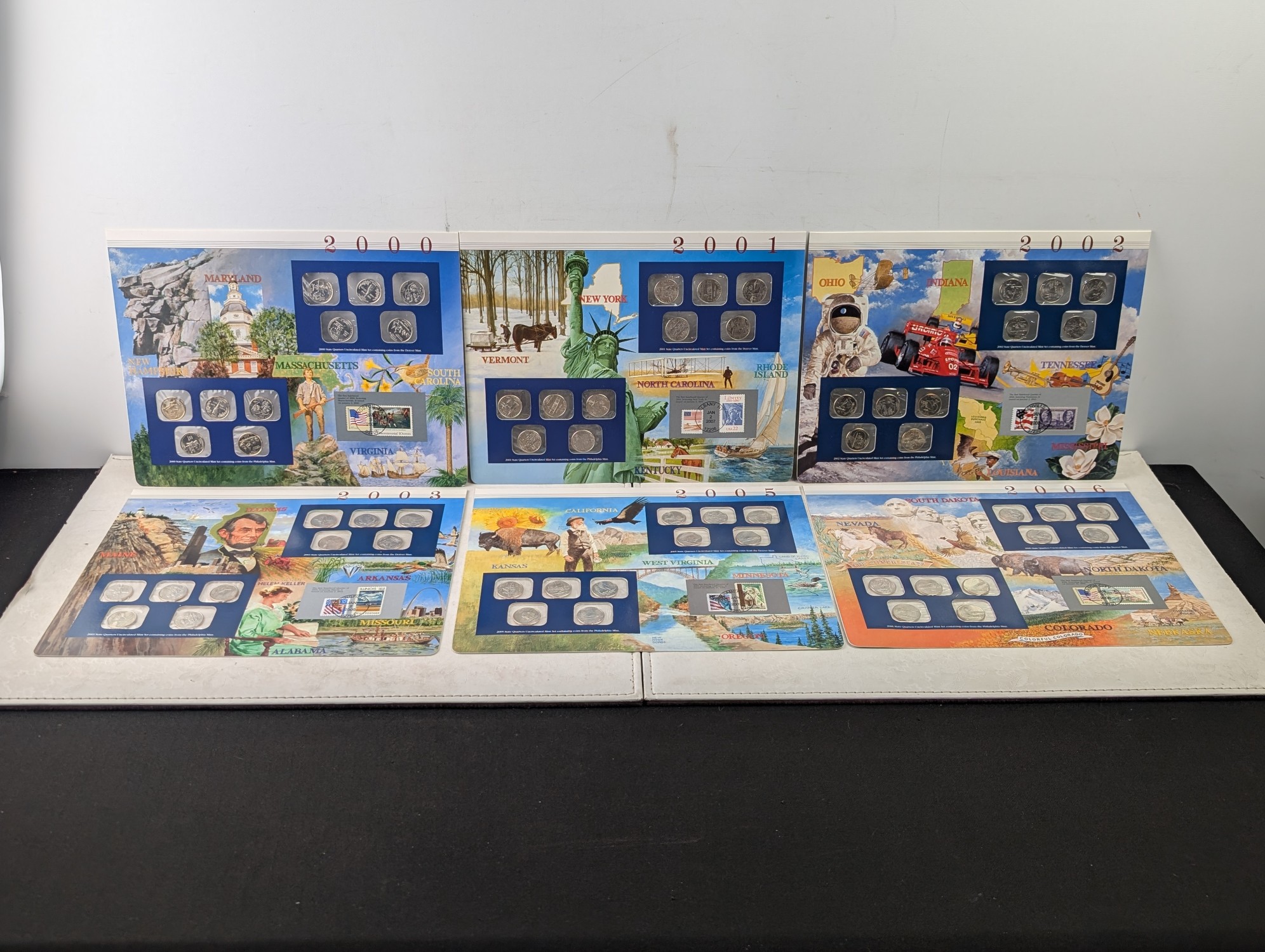 2000, 2001, 2002, 2003, 2005 and 2006-P&D U.S. Mint UNC Statehood Quarter Sets in Display w/ Commem Stamps (6 Sets) - ONLY QUARTERS