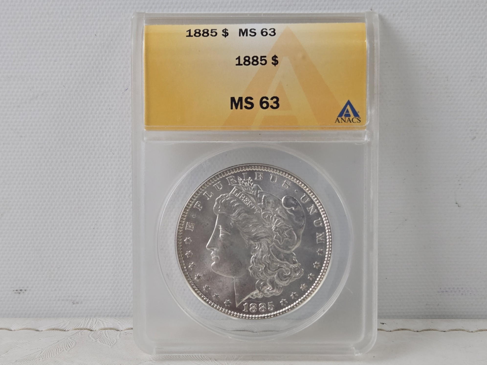 1885 Morgan 90% Silver Dollar - ANACS Cert. MS63