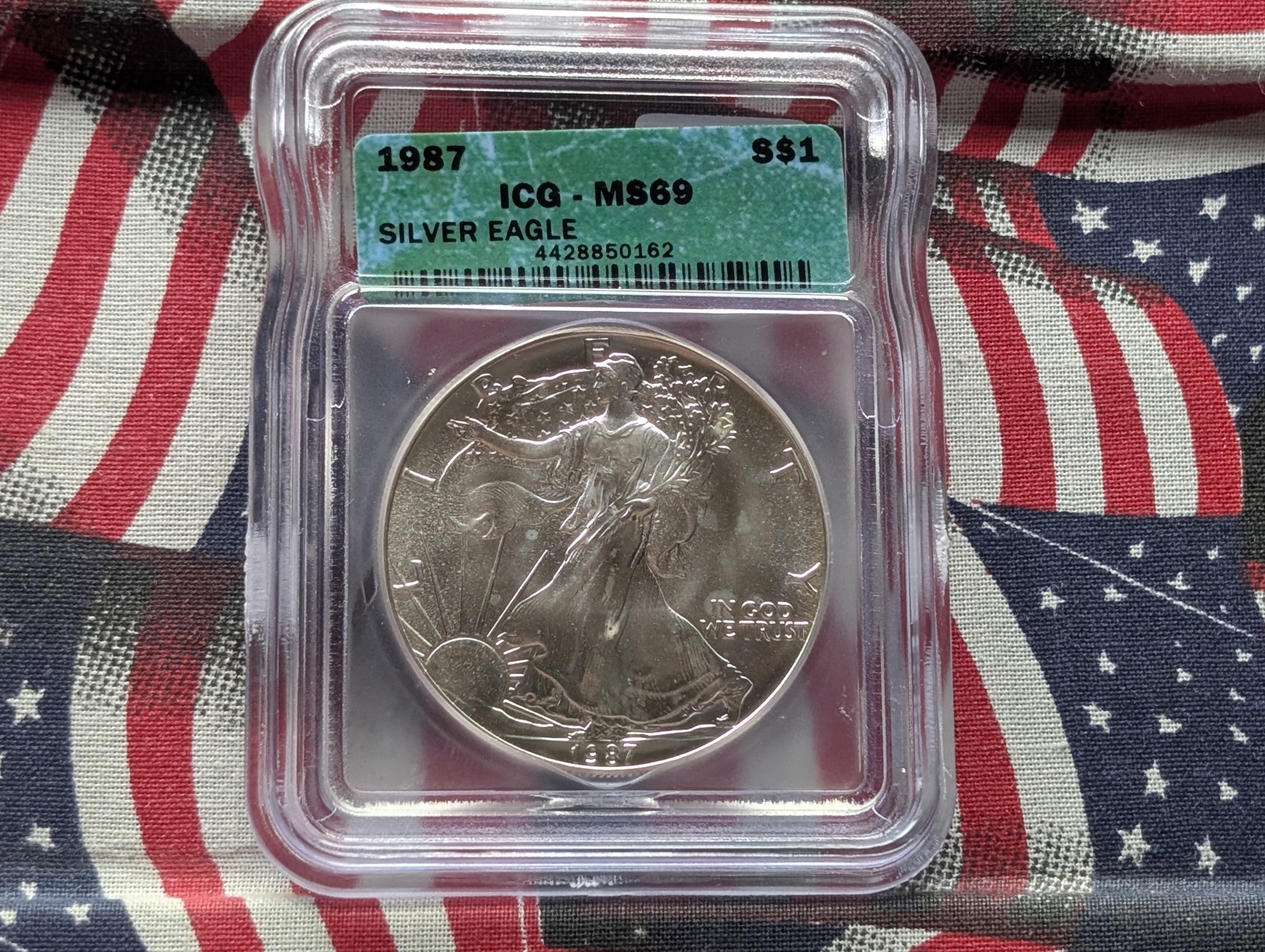 1987 American Silver Eagle 1 Troy Oz. .999 Fine Silver ICG MS69