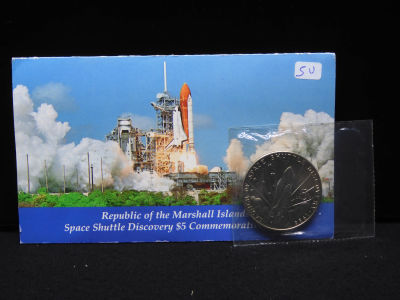 1988 $5 Space Shuttle Discovery Commemorative Coin with paperwork.