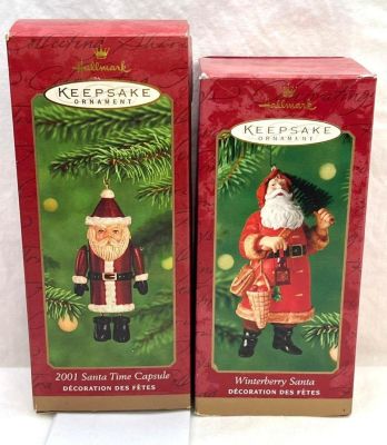 Hallmark Keepsake Ornaments lot of two Santa's Winterberry Santa and Santa Time Capsule. This 