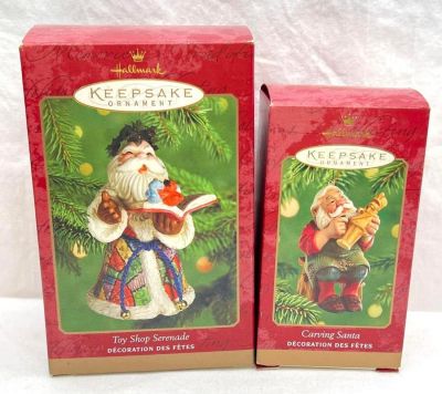 Hallmark Keepsake Ornaments lot of two Santa's Toy Shop Serenade and Carving Santa. This lot 