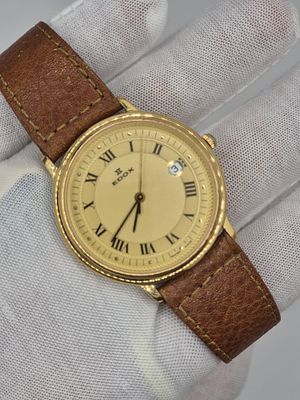שעון יפה מאוד Vintage של חברת Edox עם רצועת עור חומה, גוף זהב ולוח בצבע זהב עם אינדקסים הכוללים 