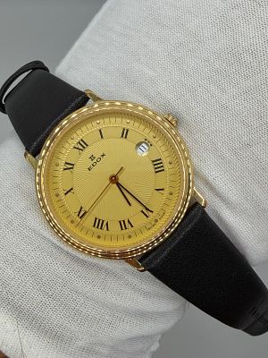 שעון יפה מאוד Vintage של חברת Edox עם רצועת עור חומה, גוף זהב ולוח בצבע זהב עם אינדקסים הכוללים 
