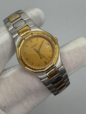 שעון יפייפה לנשים של חברת Tissot בצבע כסף וזהב, חתום PRX על הלוח, לוח בצבע זהב עם באזל מוזהב עם 