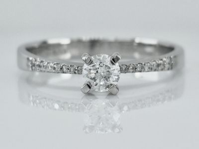 14K white gold solitaire ring set with completely natural diamonds, the central stone weighing 