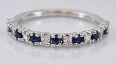 A stunning 14K white gold ring, a combination of diamonds and an amazing royal blue sapphire. 7 