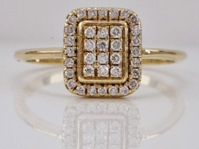 A 14K square gold ring set with completely natural diamonds weighing 0.25 carats in clean VS 