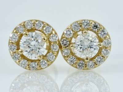 A pair of 14K gold and pink Hilo earrings set with natural diamonds in the center 0.54 carat 
