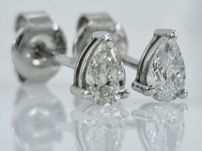A pair of 14K white gold ear studs studded with completely natural diamonds in stunning drop 