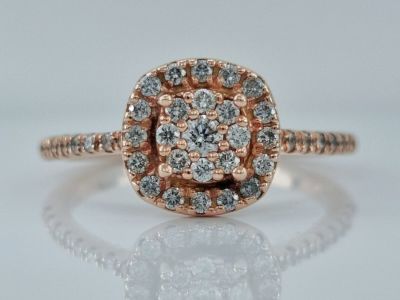A 14K rose gold gold ring set entirely with diamonds in a dense pawa inlay creates the look of 