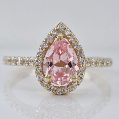14K yellow gold ring set with diamonds and morganite, the diamonds weigh 0.5 carats in clarity 