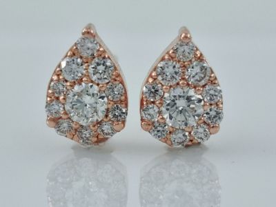 14K red gold earrings set with completely natural diamonds weighing 0.5 carats in an amazing 