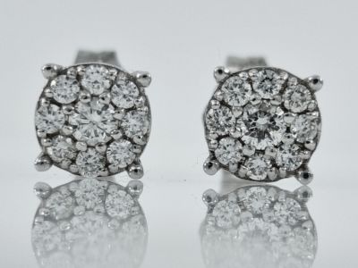 A pair of 14K white gold earrings set with completely natural diamonds, model HALO diamonds 