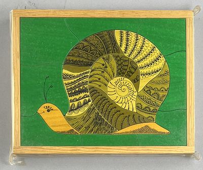 1970s Wood Snail Puzzle. Wood puzzle, depicting a stylized snail, circa 1970s, 7-1/2" x 9-1/2" x 