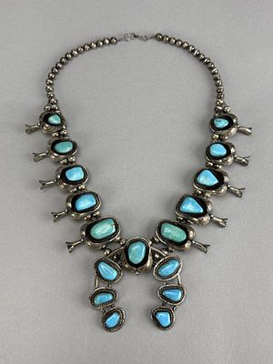 Signed J.W. Silver Squash Blossom Pawn Necklace. 24 inch long, silver 10 squash, 17 turquoise 