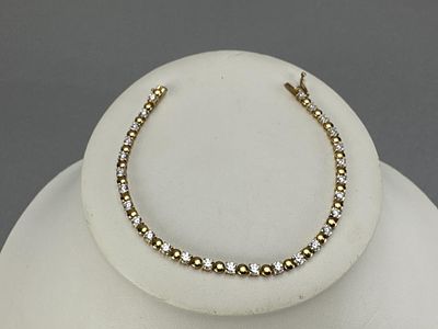 14K Yellow Gold LI Signed CZ Bracelet. Marked LI 14K on clasp, 7 inches, and weighs approx. 7.0 
