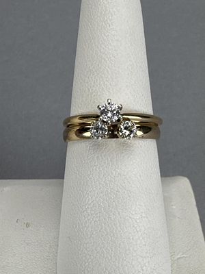 14K Yellow Gold 0.33 Carat TW Diamond Wedding Set. One ring is marked 14K, three diamonds 