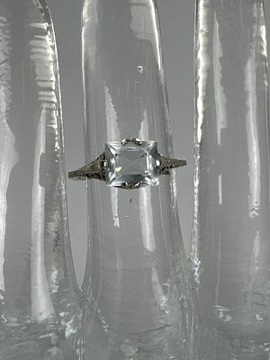 14K White Gold Aquamarine Filigree Ring. Marked 14K, size 5 1/2, and weighs approx. 1.5 grams.