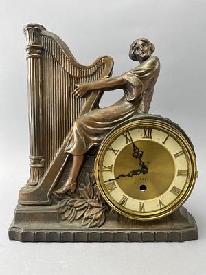 Figural Harpist Mantel Clock Model No. 280. Bronze-tone figural mantel clock featuring a harpist 