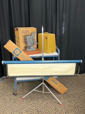 DeJUR 750 8mm Projector with Accessories. DeJUR 750 8mm film projector with original box, a 