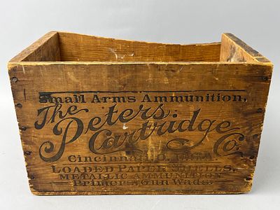 Wooden Peters Cartridge Company Ammunition Box. A wooden ammunition box featuring engraved text 