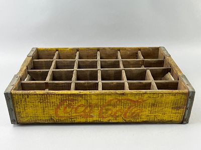 Wooden Coca-Cola Bottle Crate with Dividers. A wooden Coca-Cola bottle crate featuring yellow 