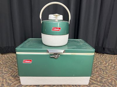 Coleman Cooler and Water Jug Set. Coleman green and white metal cooler with latch closure and 
