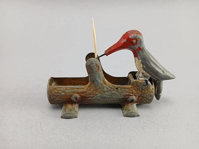 Cast Iron Woodpecker Toothpick Holder. Cast iron toothpick holder featuring a woodpecker motif 