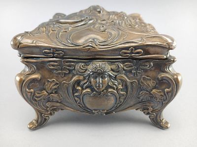 Ornate Metal Jewelry Box with Hinged Lid. Ornate metal jewelry box featuring a hinged lid and 