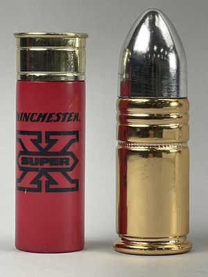 2 Novelty Ammo-Shaped Aftershave Bottles. Set of two novelty aftershave containers designed to 