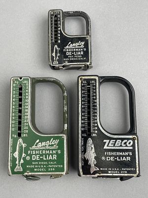 3 Fisherman's De-Liar Scales, Langley & Zebco. A lot of three vintage fishing scales, including 