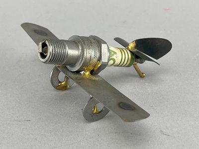 Handmade Spark Plug Plane Sculpture, 5" Wide. Handmade spark plug plane sculpture featuring a 