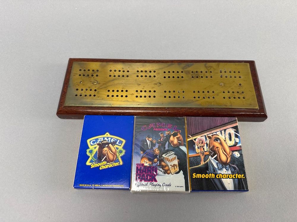 Vintage Cribbage Board W/ Camel Playing Cards. Vintage brass and wood cribbage board inches long 