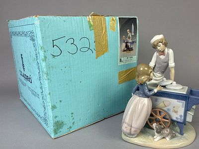 Lladro 5325 'Ice Cream Vendor' Figurine. Lladro figurine titled 'Puesto de helados,' model 