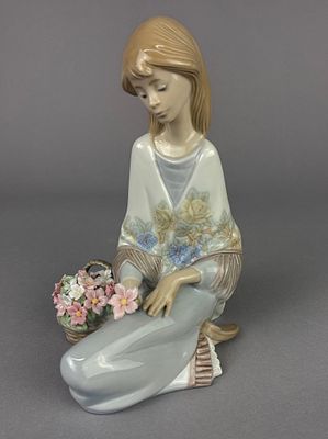 Lladro 7607 ‘Flower Song' Figurine. Lladro porcelain figurine titled 'Flowers of the Season,' 