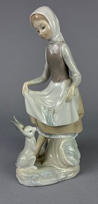 Lladro 4826 'Rabbit's Food' Figurine. Lladro porcelain figurine titled 'Rabbit's Food,' model 