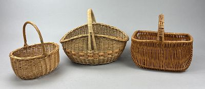 Three Wicker Baskets, Oval & Rectangular. Set of three handwoven wicker baskets featuring 