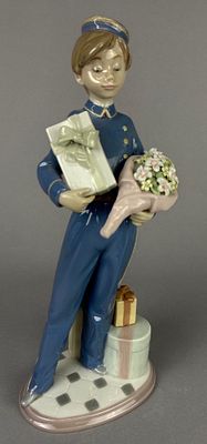 Lladro 5783 Bellboy with Flowers Figurine. Lladro porcelain figurine titled 'Bellboy with 