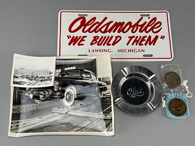 Oldsmobile 1977 Factory Memorabilia Set w/ Medals & Photos. Oldsmobile memorabilia commemorating 