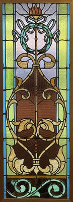 Antique Stained Glass Panel 25" x 68". Antique stained glass panel, in a later oak frame with 