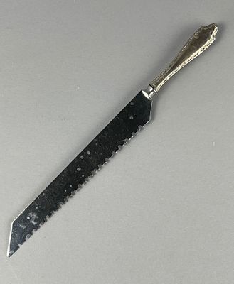 Sterling Silver Serrated Knife with Decorative Handle. Sterling silver handle serrated knife 