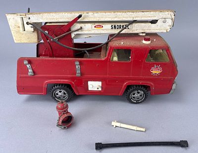 Tonka Fire Truck with Ladder and Bucket. Tonka red toy fire truck with white ladder and red 