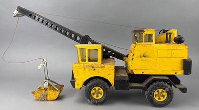 Tonka Yellow Metal Toy Crane with Bucket Attachment. Tonka yellow metal toy crane with a movable 