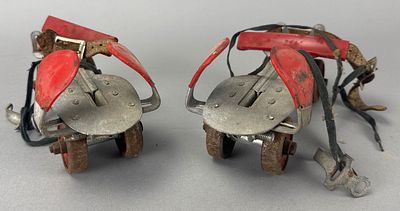 Adjustable Roller Skates with Metal Wheels, Red Plastic Stops. Pair of adjustable roller skates 