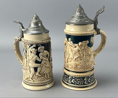 Pair of German Ceramic Beer Steins with Pewter Lids. Pair of German ceramic beer steins with 