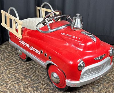 Metal Pedal Car Fire Truck with Chrome Details. Red metal pedal car with fire truck design 