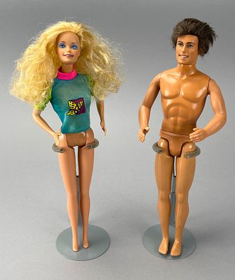 Mattel Pair of Dolls with Stands, 1960s. Pair of Mattel plastic dolls. The female doll features 