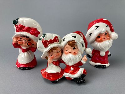 Ceramic Santa & Mrs. Claus Salt and Pepper Shakers. Four ceramic figurines featuring Santa and 